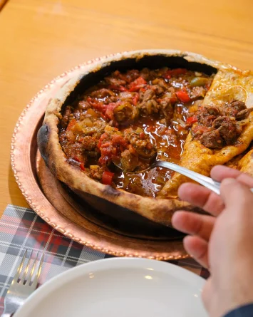 Traditional Hatay dishes slow-cooked in stone oven at Hatay Gurme